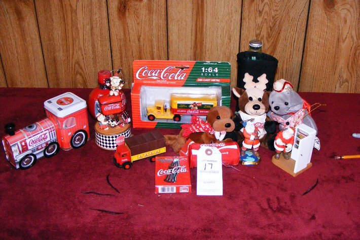 Assorted Coca Cola memorabilia - stuffed animal, die cast trucks, playing cards, ornament