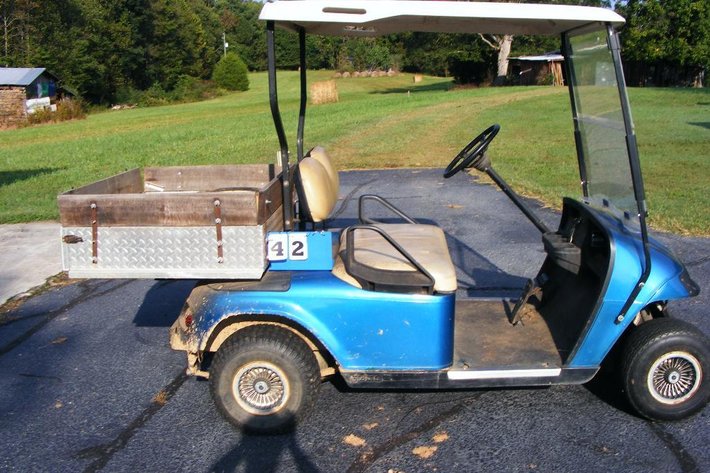 EZ Go golf cart - runs, SN 1352936, gas powered 2 cylinder engine, aluminum bed