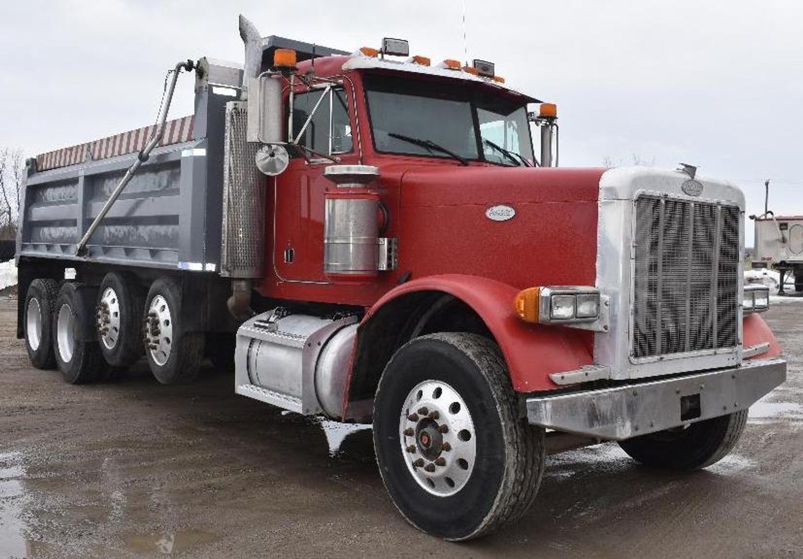 (4) Peterbilt Quad Axle Dump Trucks