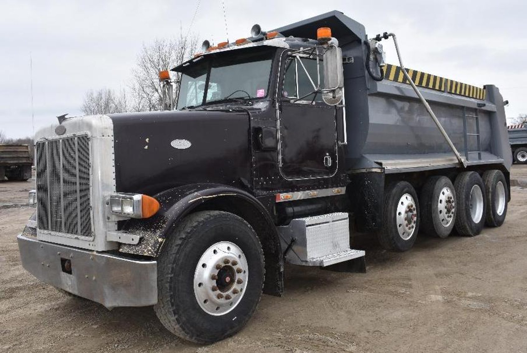 (4) Peterbilt Quad Axle Dump Trucks