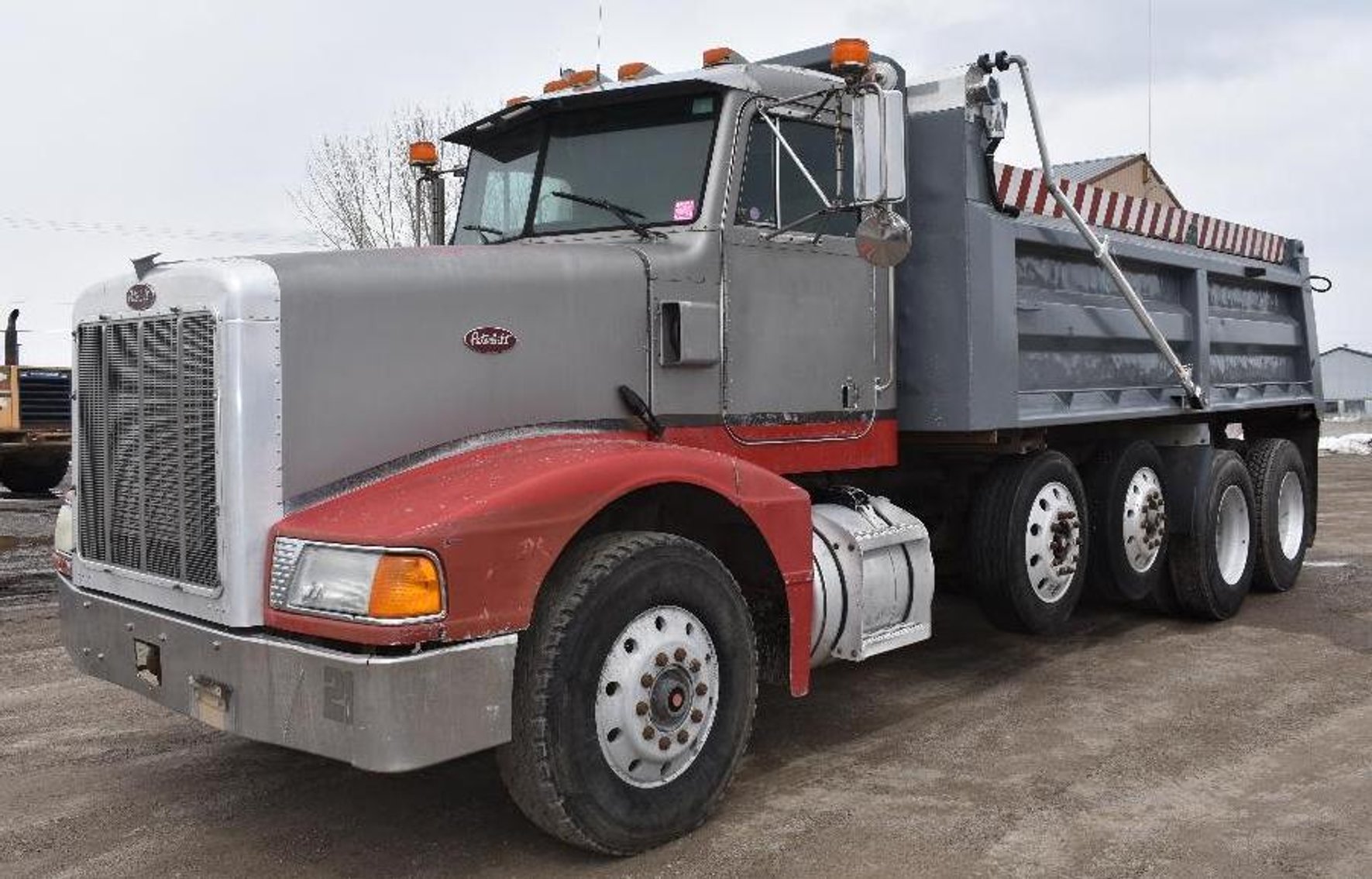 (4) Peterbilt Quad Axle Dump Trucks