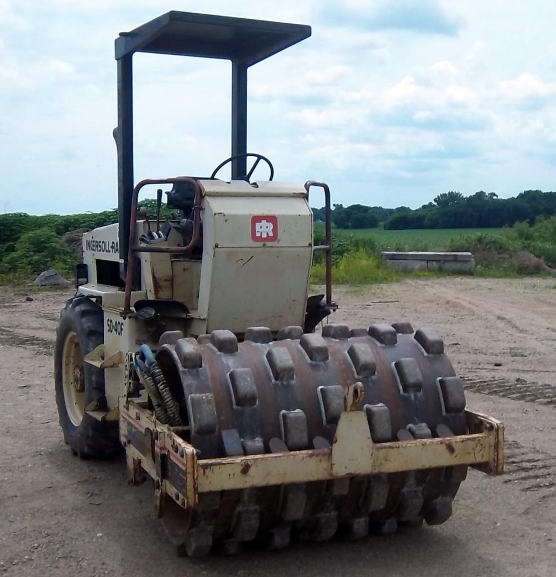 2007 IHC 9400 Semi, Ingersoll Rand Packer, John Deere Dozer, Road Grader & Caterpillar Extendahoe