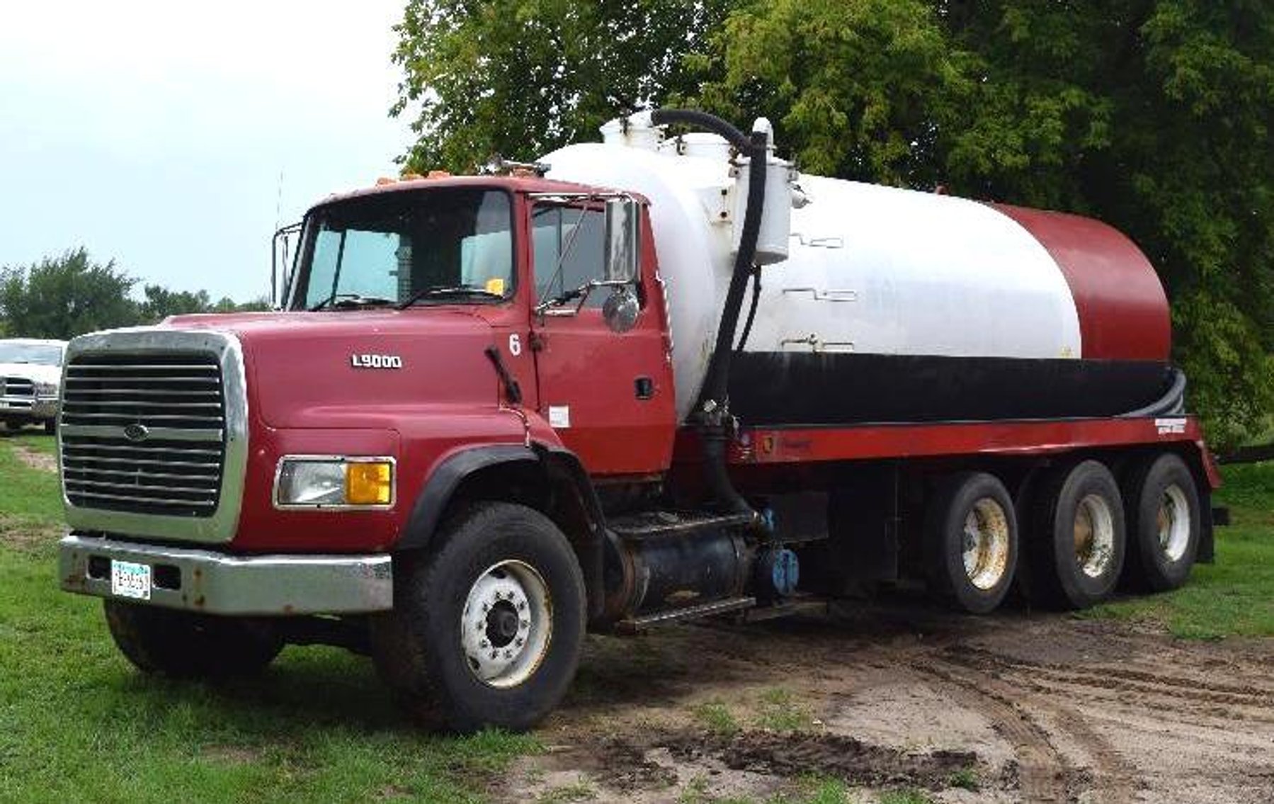 (2) Fords & (1) IH Sewer Pumper Trucks, Western Star Semi, Flatbed Semi Trailer