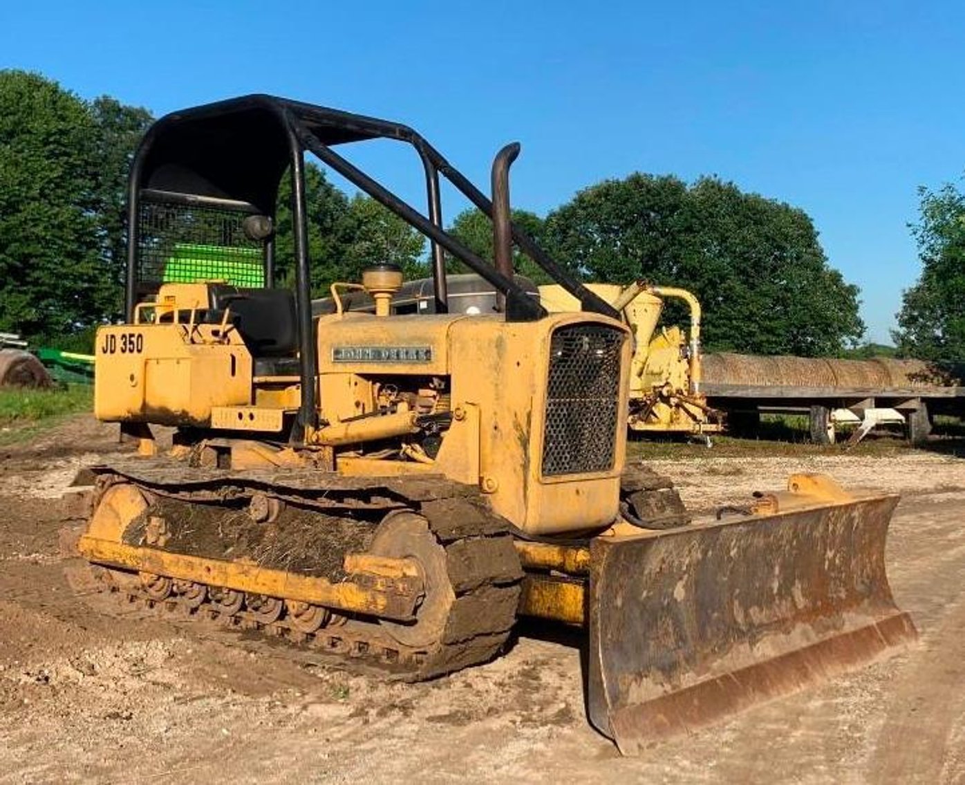 John Deere 350 Dozer, Cat 951B Traxcavator, 1987 Ford F800 10' Dump Box, IH Disc. & 12' V-Plow