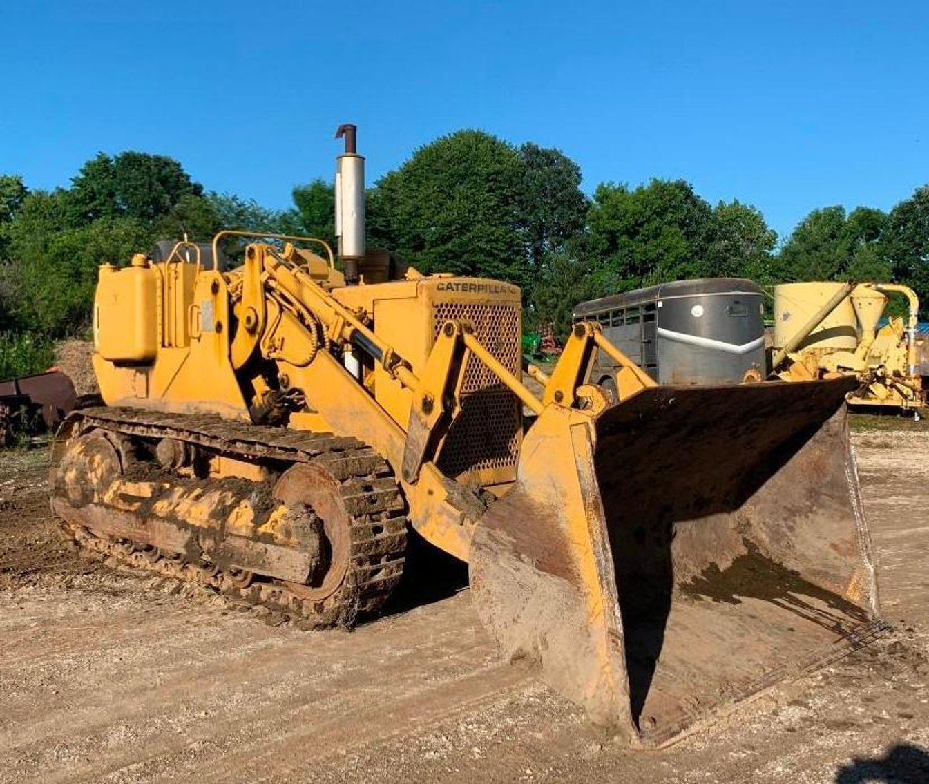 John Deere 350 Dozer, Cat 951B Traxcavator, 1987 Ford F800 10' Dump Box, IH Disc. & 12' V-Plow