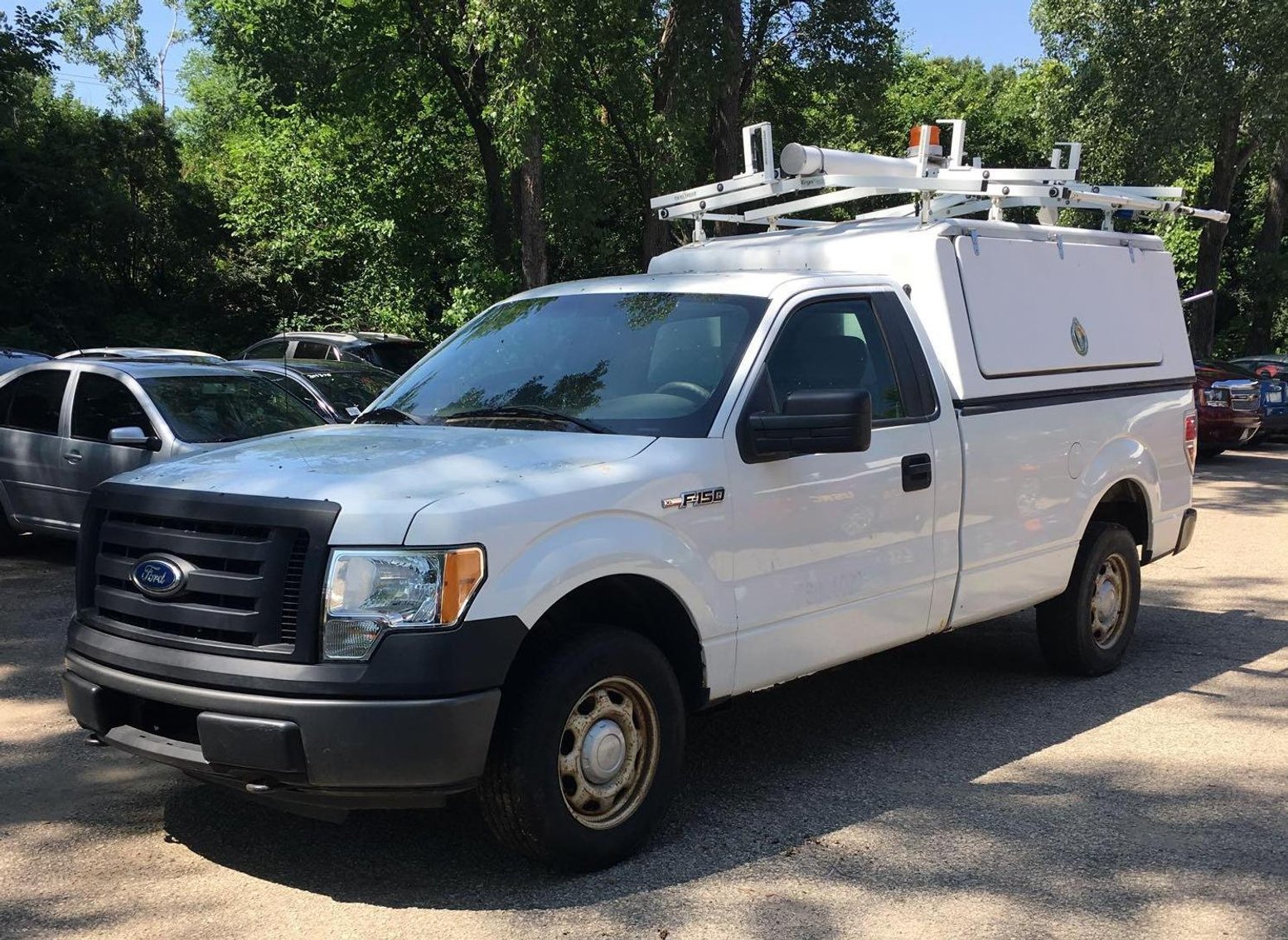 2009 Ford F-350 With Plow, 2011 Ford E-350 Cargo Van, 2010 Ford F-150 XL With Utility Topper & Bobcat 843