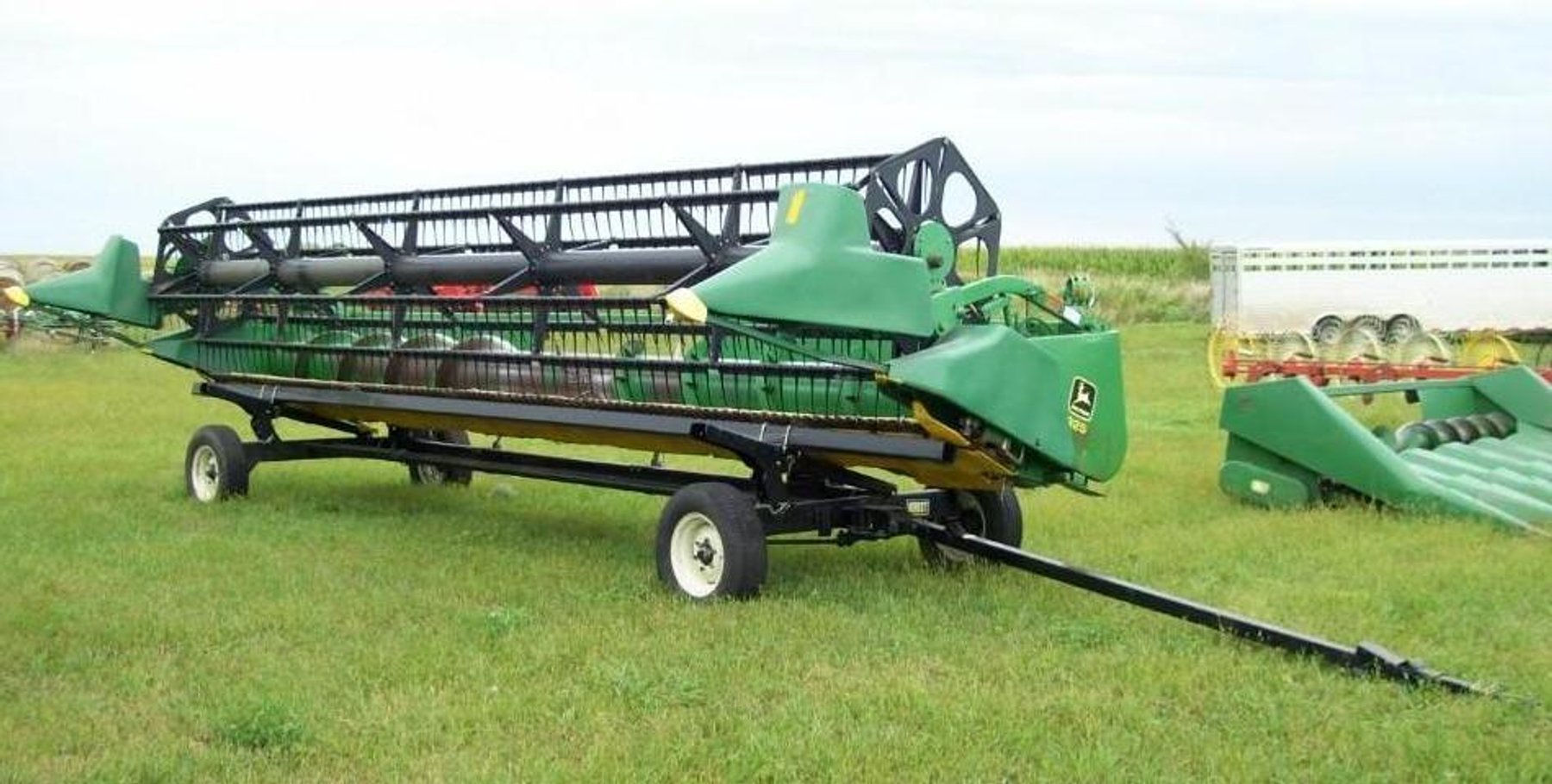 Farm Machinery: John Deere 9500 Combine, John Deere Flex Head and Corn Head, 2002 New Holland LS 170 & Attachments