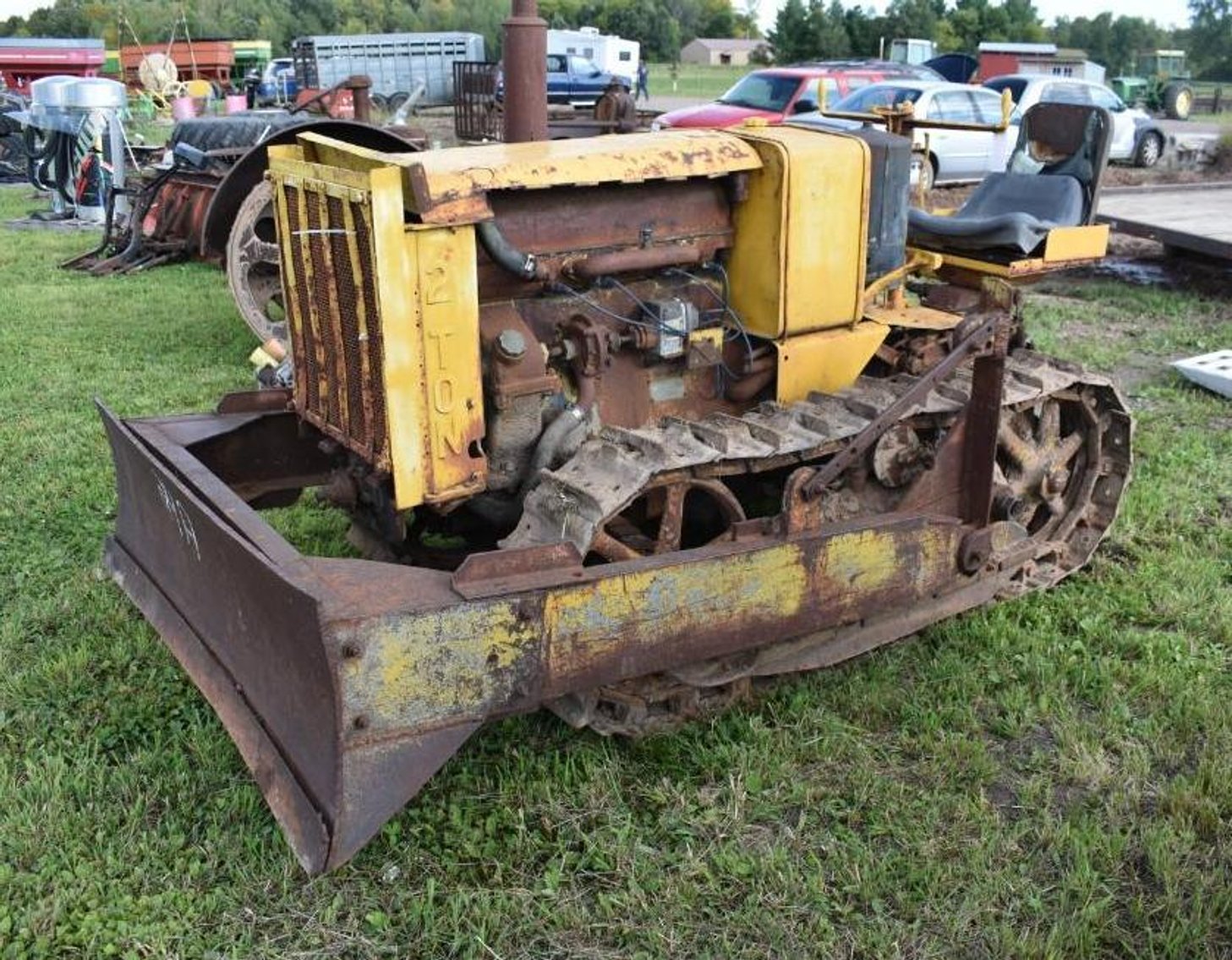 Farm Machinery: (12) Gravity Boxes, Cat Dozer, Cattle Trailer, Vintage Tractor & Attachments