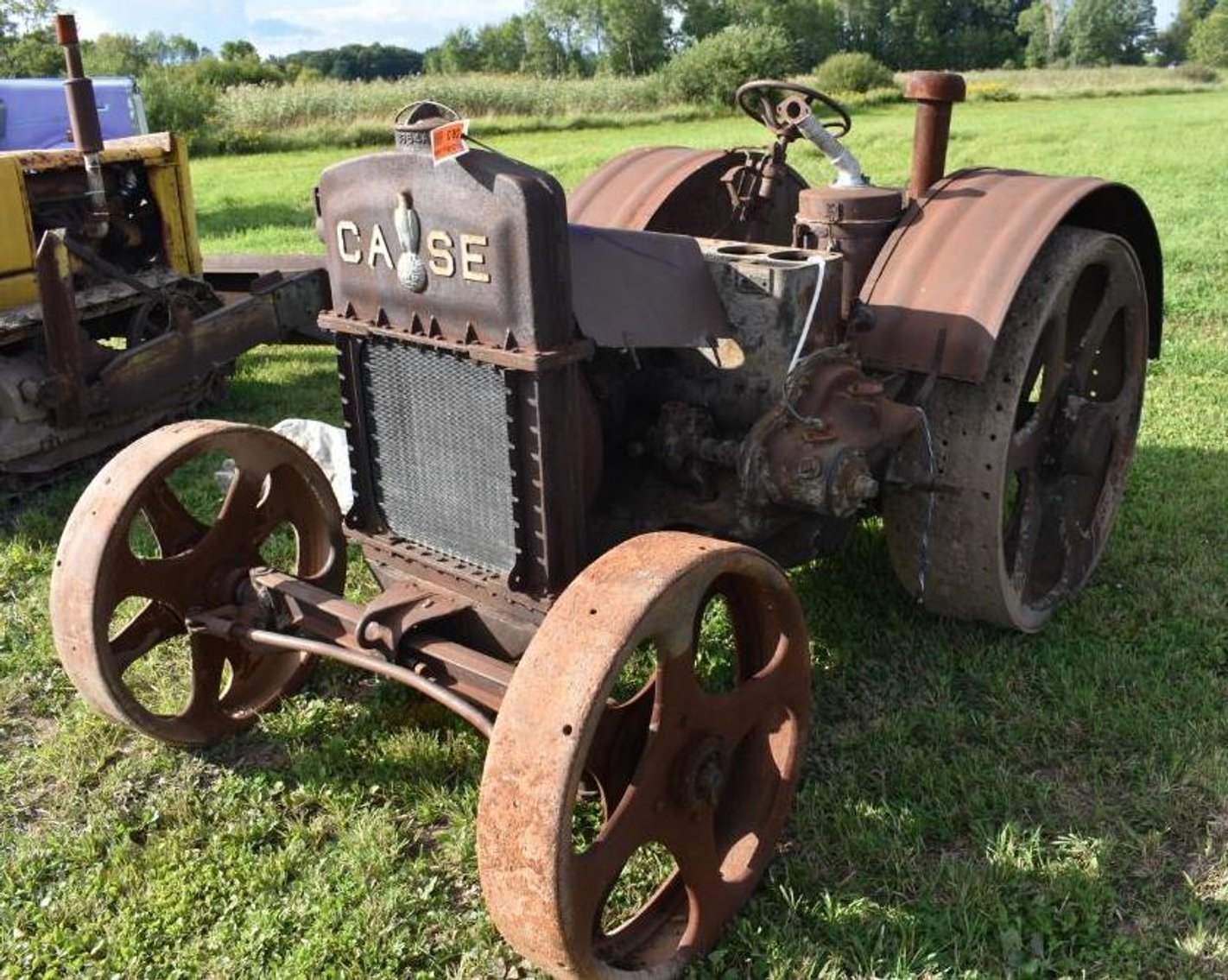 Farm Machinery: (12) Gravity Boxes, Cat Dozer, Cattle Trailer, Vintage Tractor & Attachments