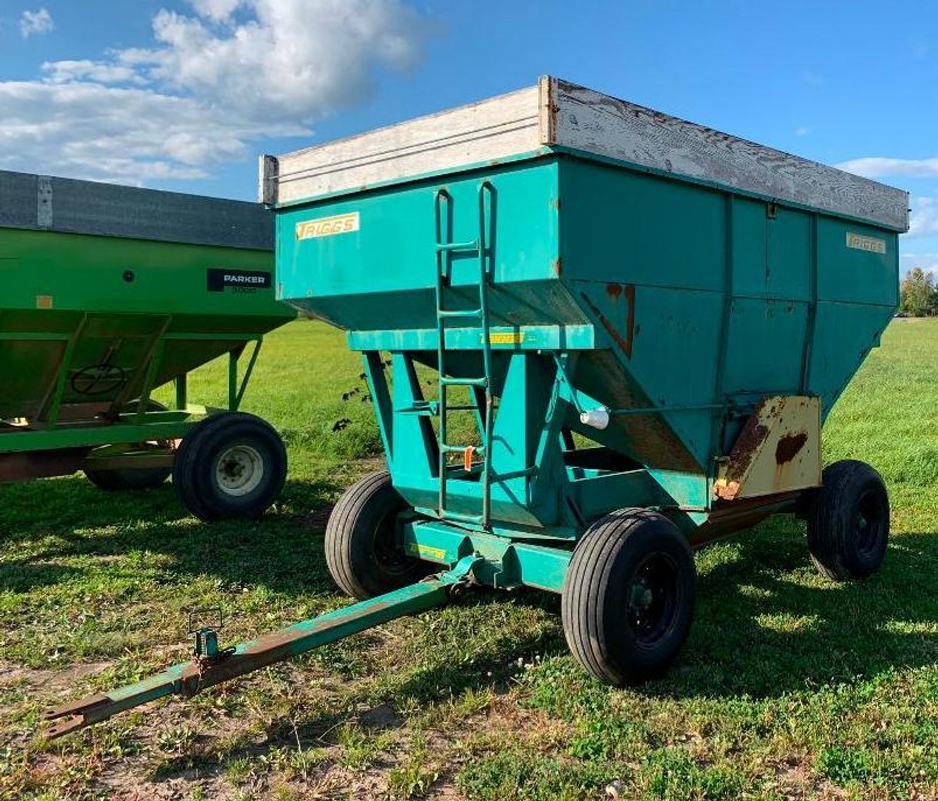 Farm Machinery: (12) Gravity Boxes, Cat Dozer, Cattle Trailer, Vintage Tractor & Attachments