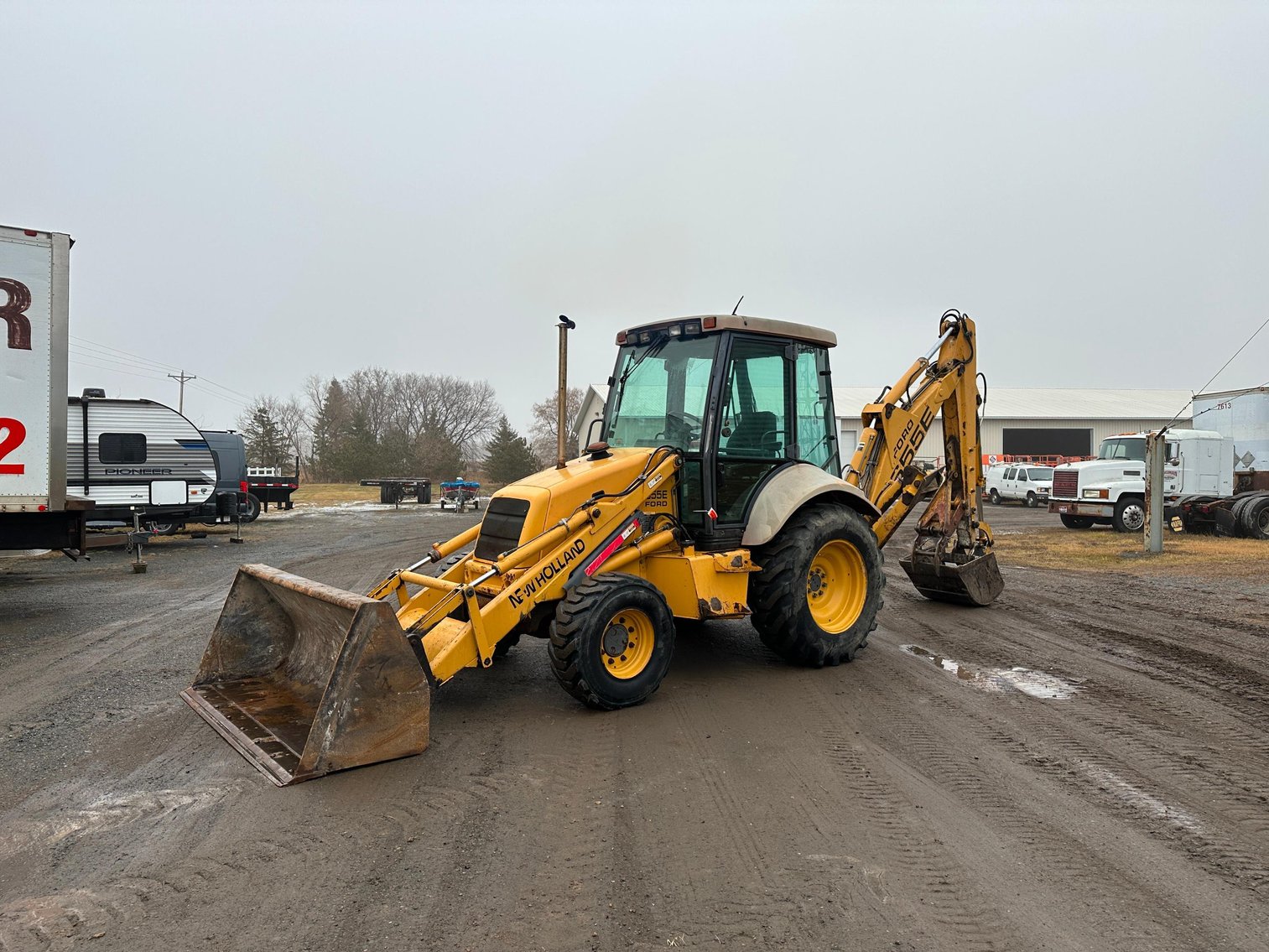 (2) Backhoes, New Holland Skid Loader, Plows