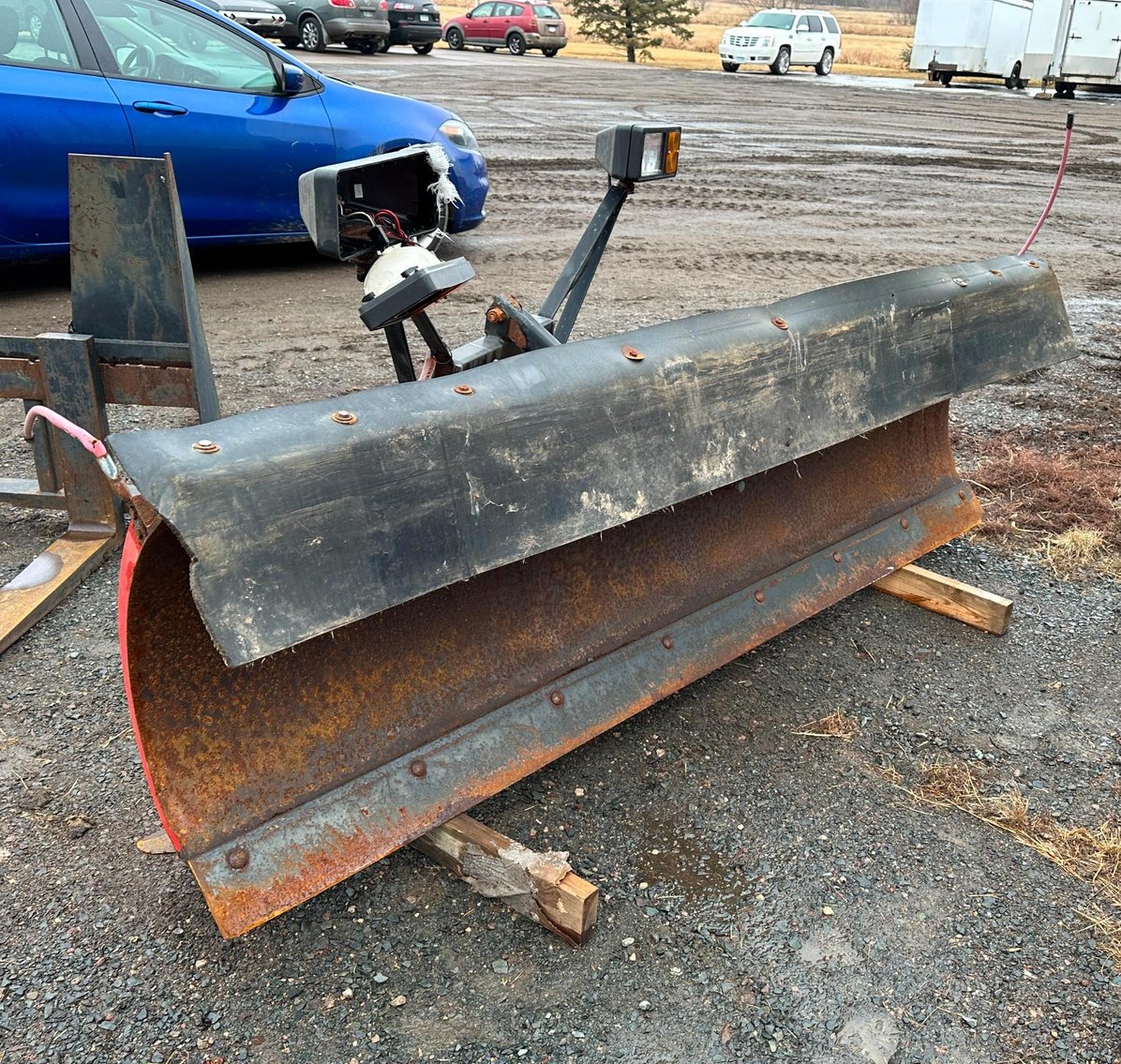 (2) Backhoes, New Holland Skid Loader, Plows