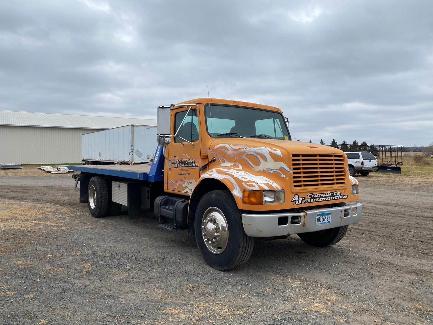 1995 International 4900 Roll Back & 1998 Hide a Bed Gooseneck Trailer