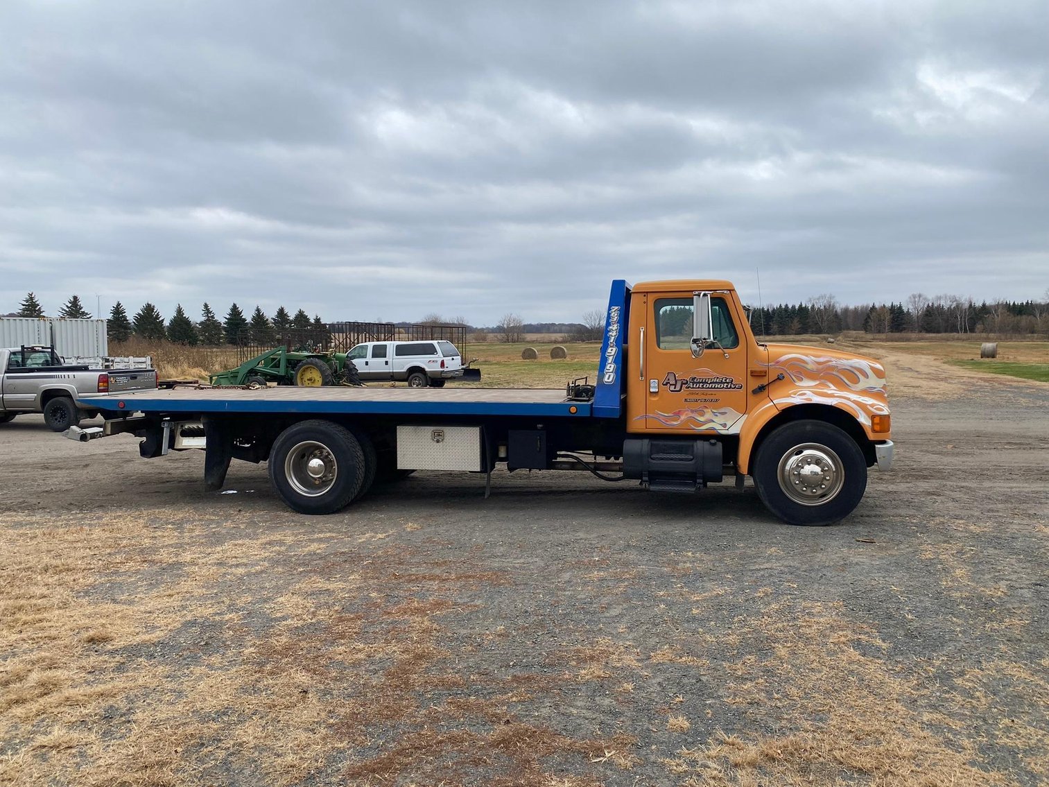 1995 International 4900 Roll Back & 1998 Hide a Bed Gooseneck Trailer