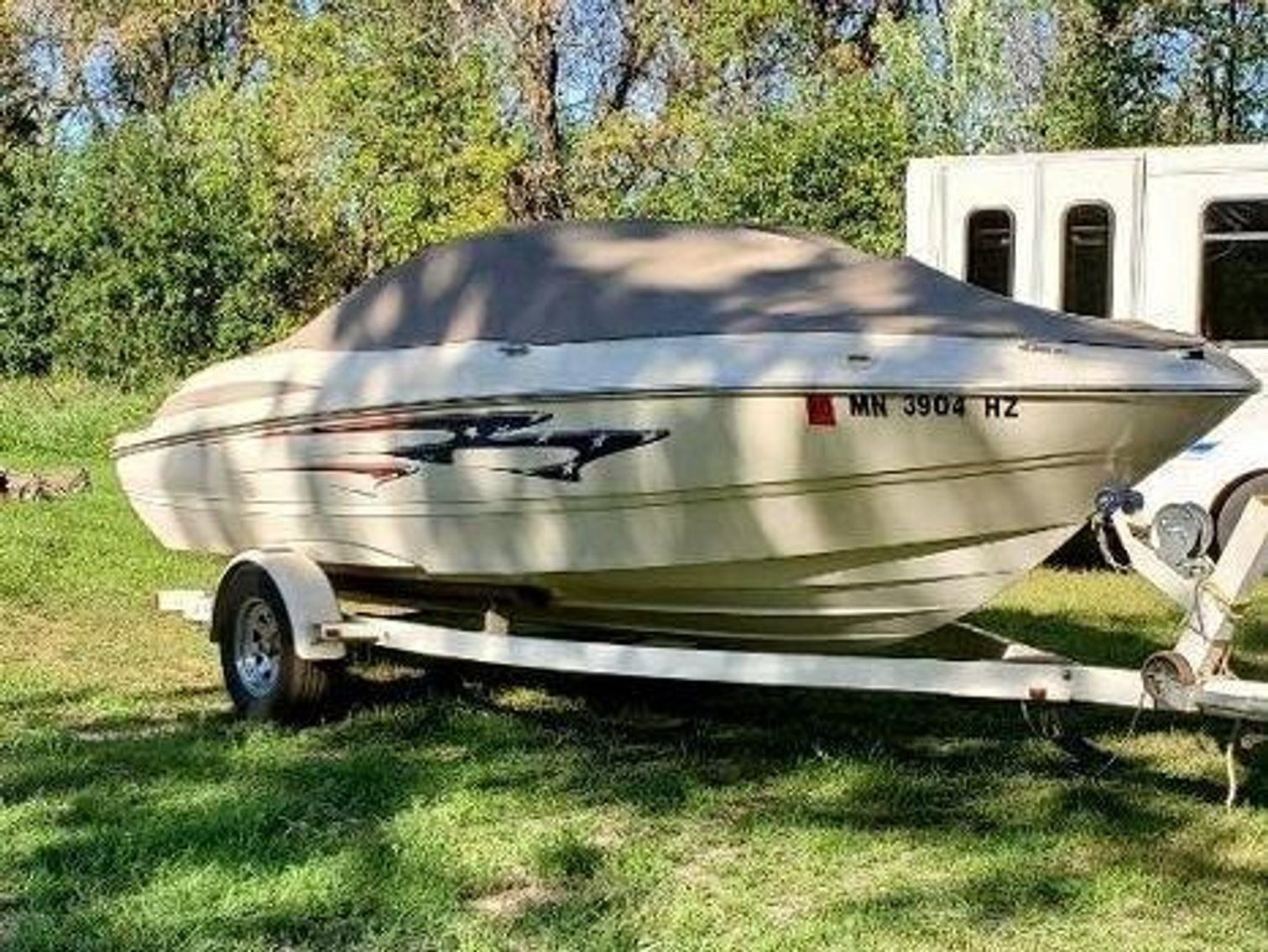 (2) 1935 Classic Cars, 2001 Ford Motorhome, Farmall Tractor, 18' Boat & Lawn Mowers