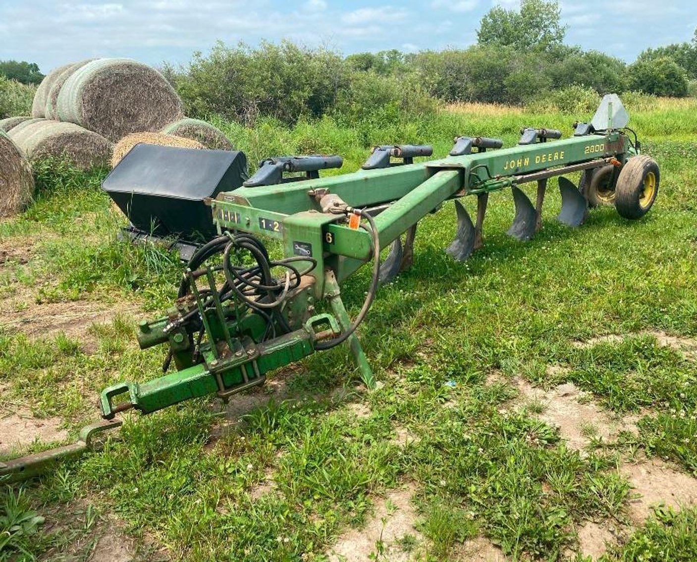 Surplus Farm Equipment, JD Plows, Gravity Box, Baler and More