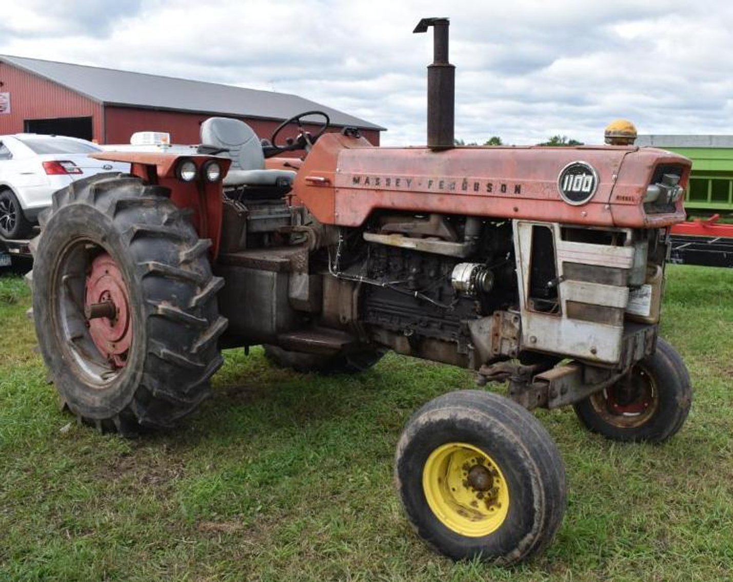 (5) Gravity Boxes, Mighty 8 Round Bale Hauler & Massey Ferguson 1100 Diesel Tractor