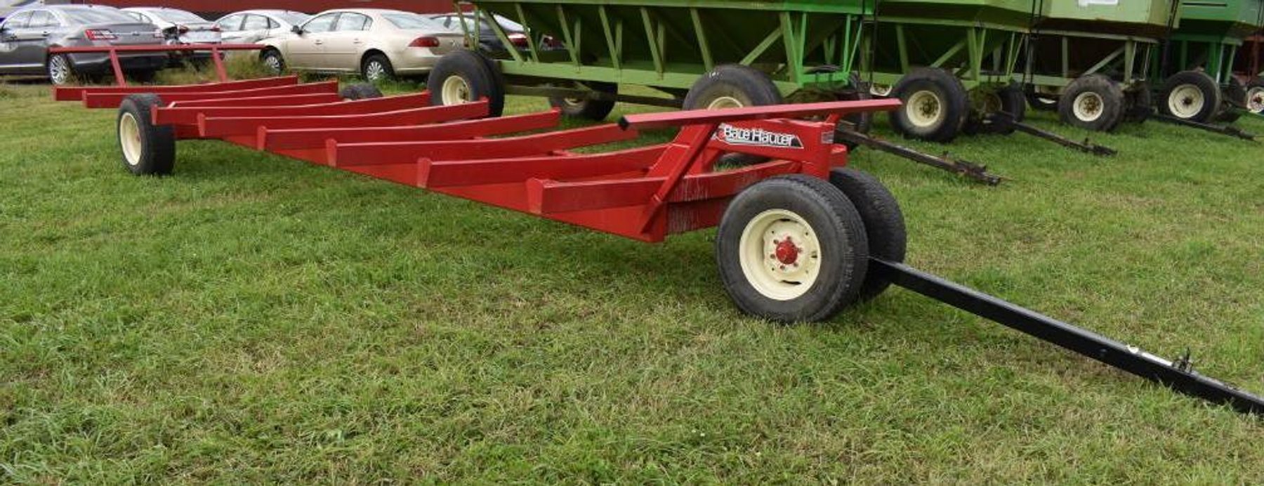 (5) Gravity Boxes, Mighty 8 Round Bale Hauler & Massey Ferguson 1100 Diesel Tractor