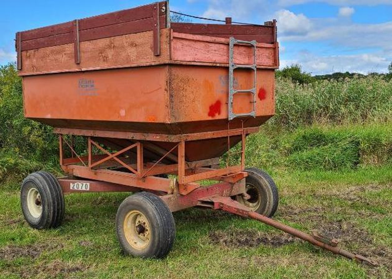 (5) Gravity Boxes, Mighty 8 Round Bale Hauler & Massey Ferguson 1100 Diesel Tractor