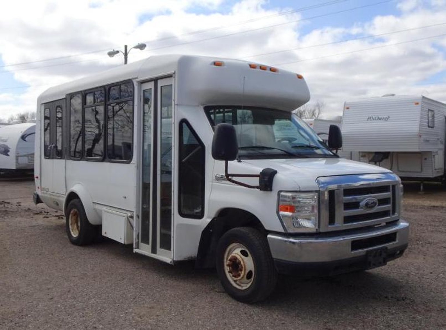 2012 Ford E-150 Cargo Van, 2011 Lincoln MKT, 2009 Ford F-350 Conversion Mini Bus, 2004 Haulmark Low Hauler Trailer