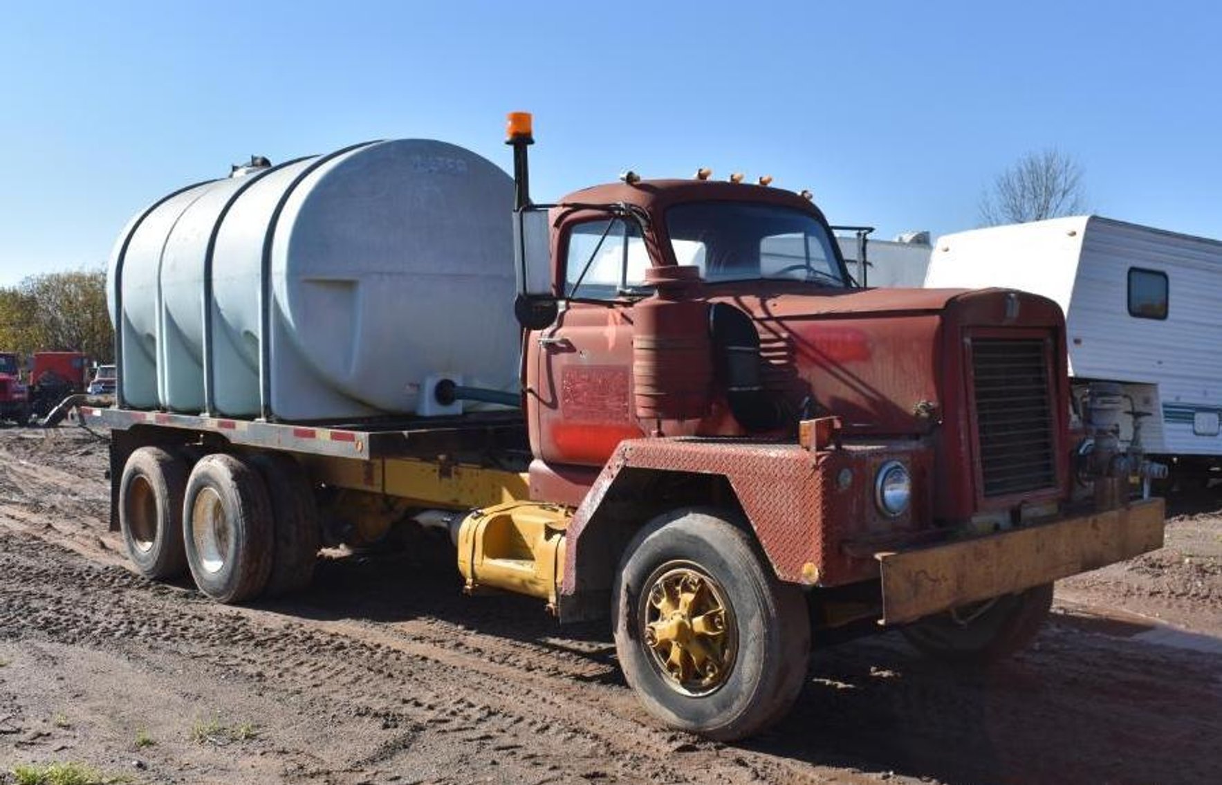 2013 Kubota SVL 90-2 Skid, 2003 IH Car Hauler, 20' Flatbed, Wrecker Body, Water Truck, Attachments