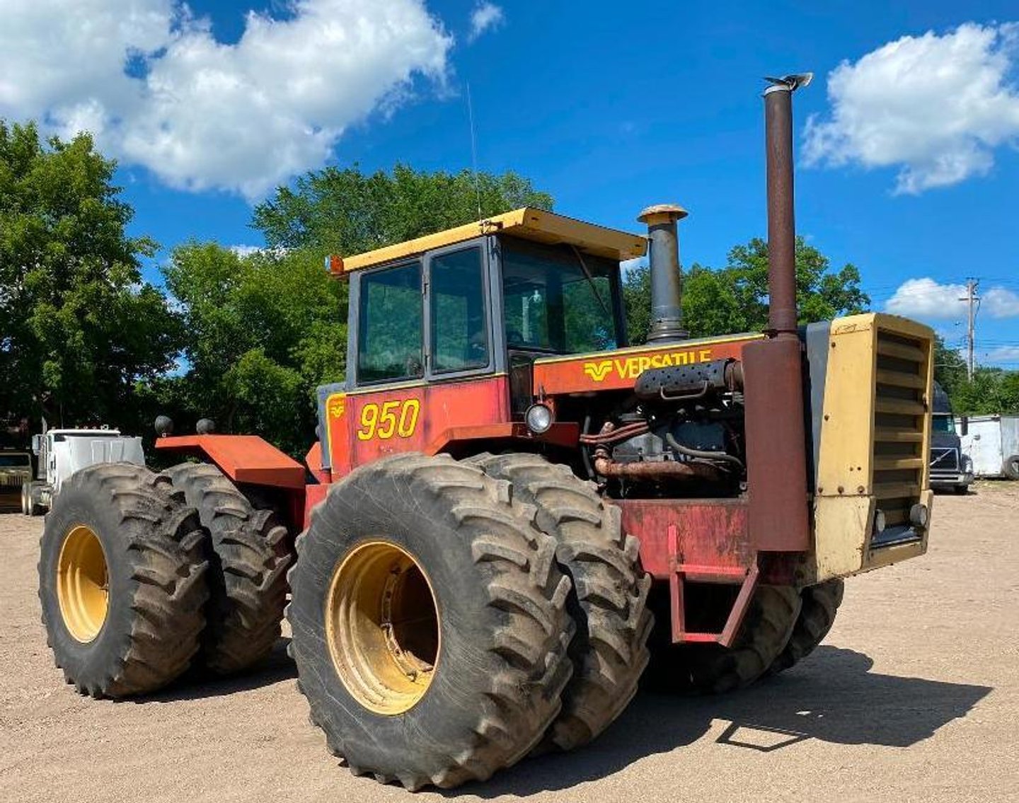 (7) Semis, (8) Grain Trailers, 1981 Versatile 950, 2007 International Bucket Truck