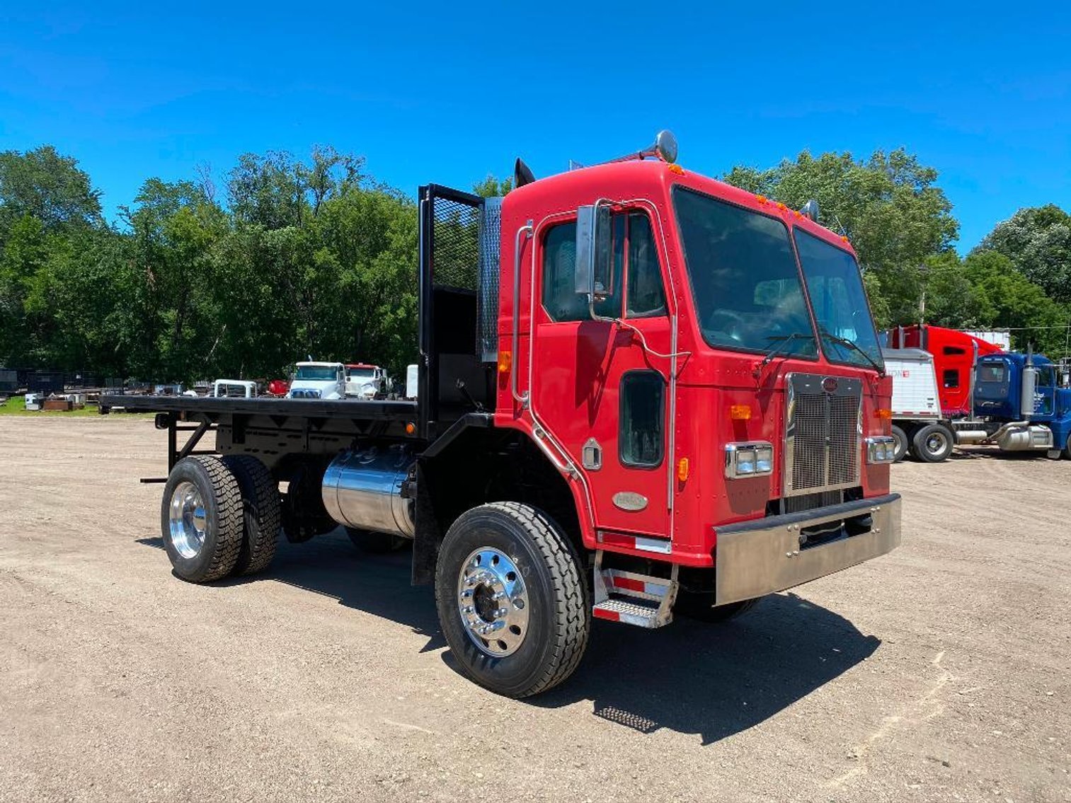 (7) Semis, (8) Grain Trailers, 1981 Versatile 950, 2007 International Bucket Truck