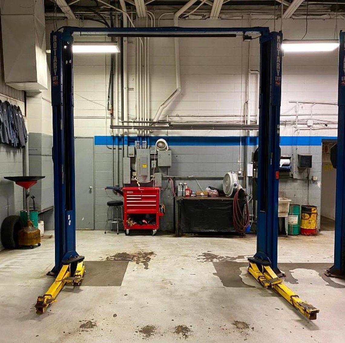 Excess Shop & Parts Room Equipment Due to Store Remodeling: (33) Car Hoists, Mezzanine, & Office Furniture