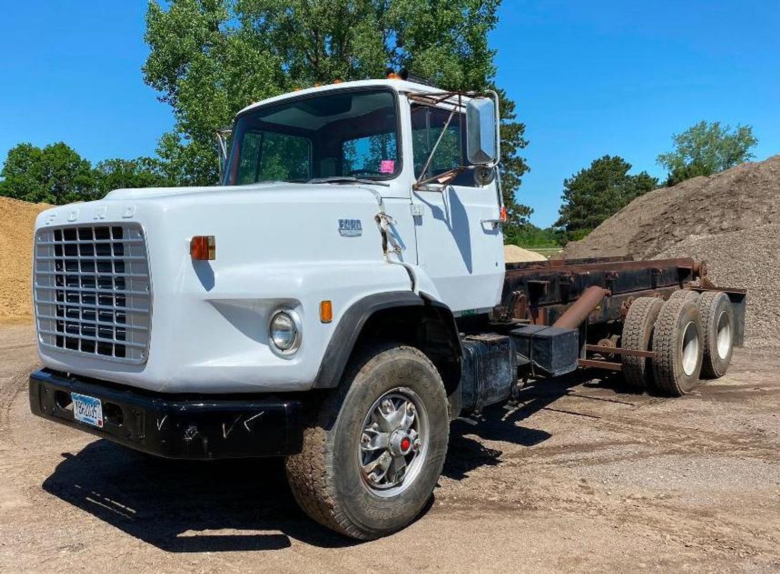 Excavating Surplus Equipment: 52' Step Deck, Trucks, Loader, End Dump, Roller