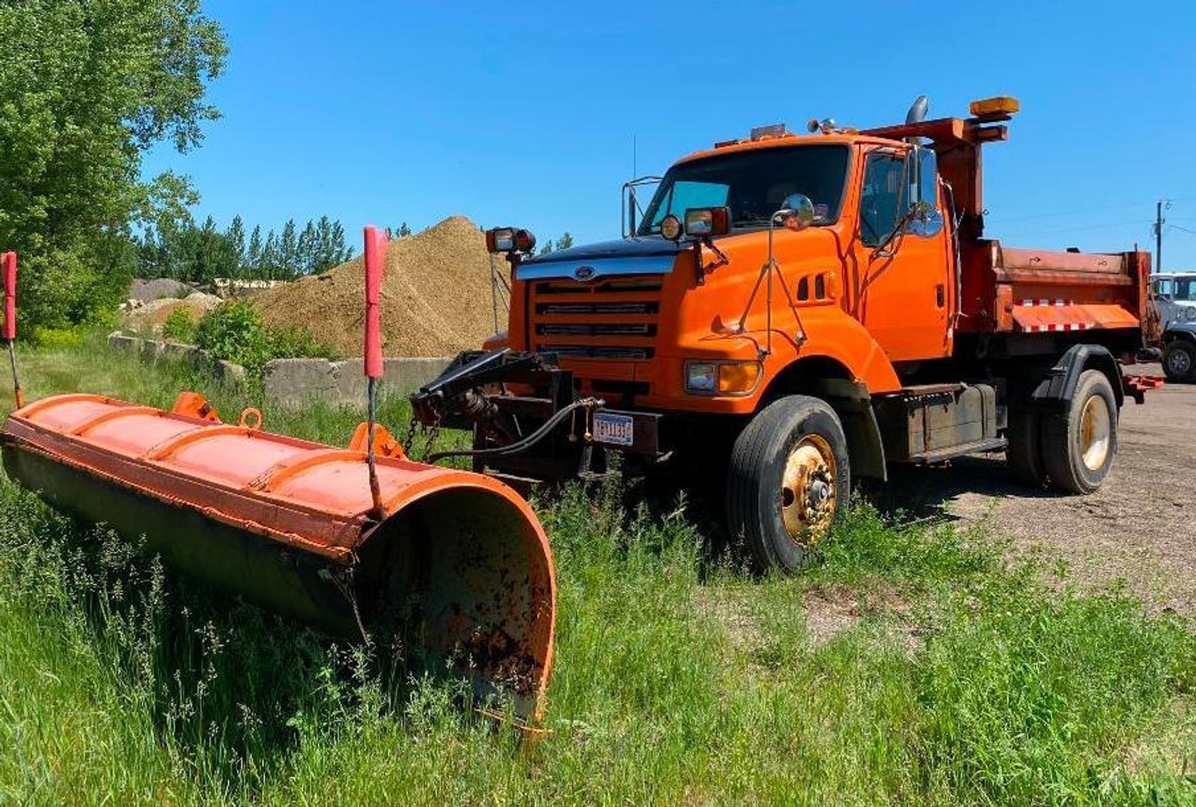 Excavating Surplus Equipment: 52' Step Deck, Trucks, Loader, End Dump, Roller