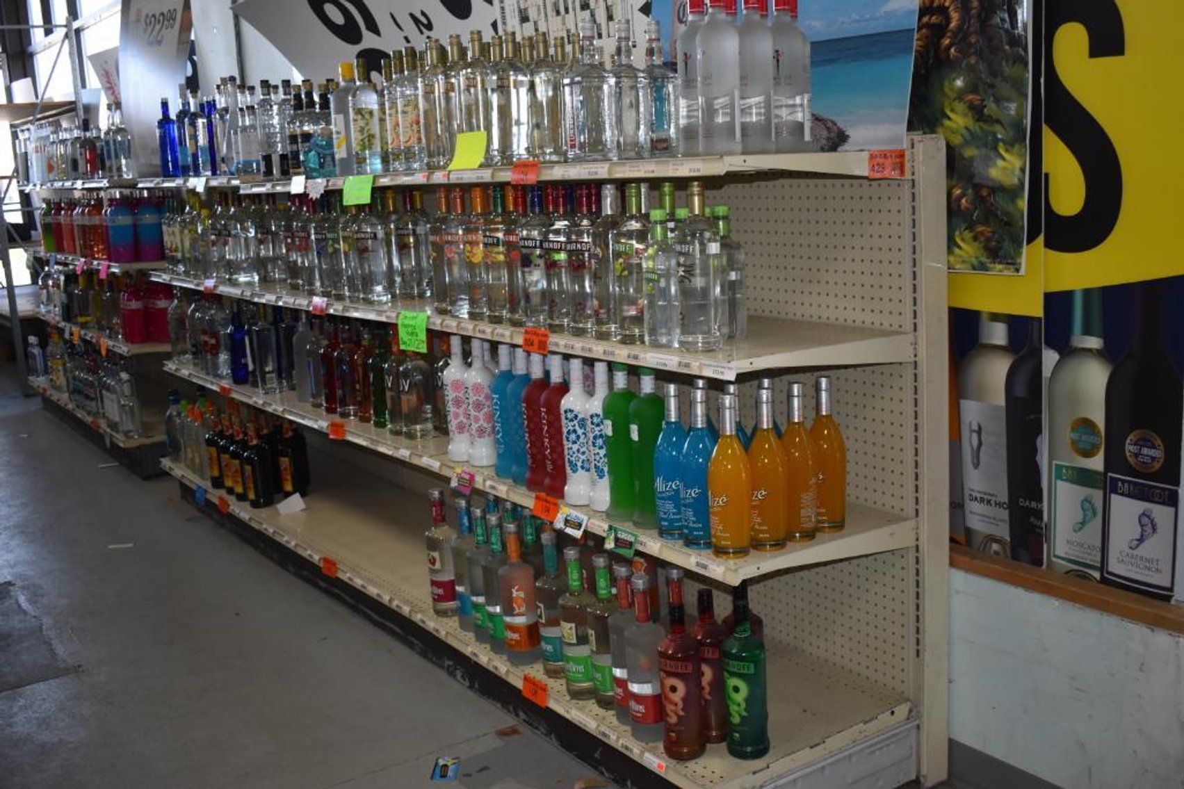 Complete Liquor Store Liquidation: Walk-In Merchandising Cooler, Neon Signs, Advertisements, Displays and Shelving