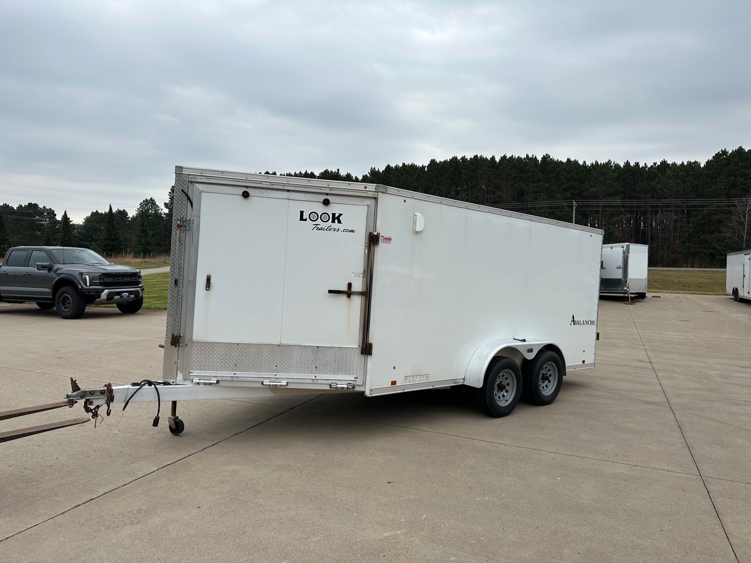 2014 Mercedes E350 4Matic, 2023 and 2016 3-Place Snowmobile Trailers